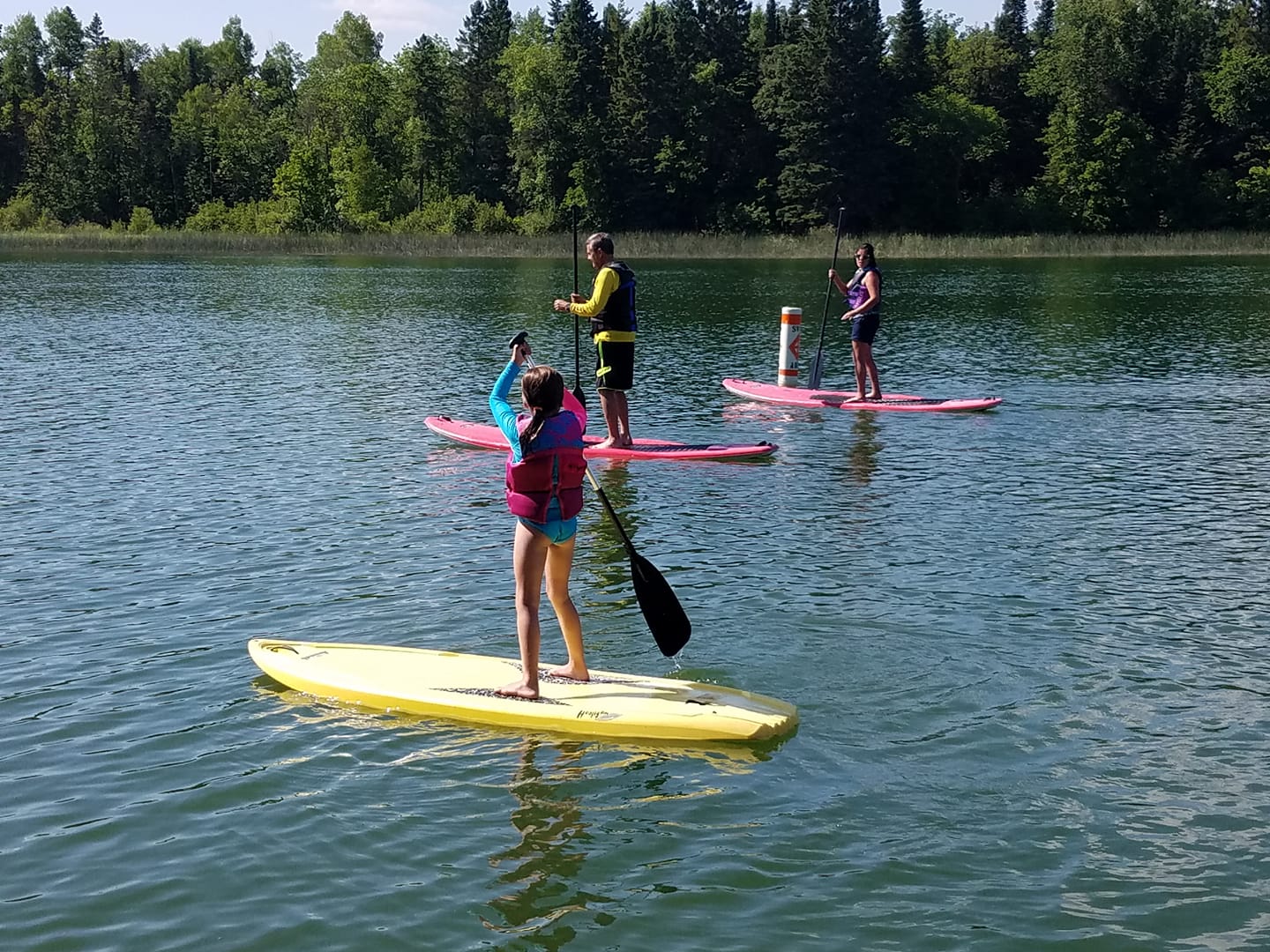 Family kayaking on Big Elbow Lake