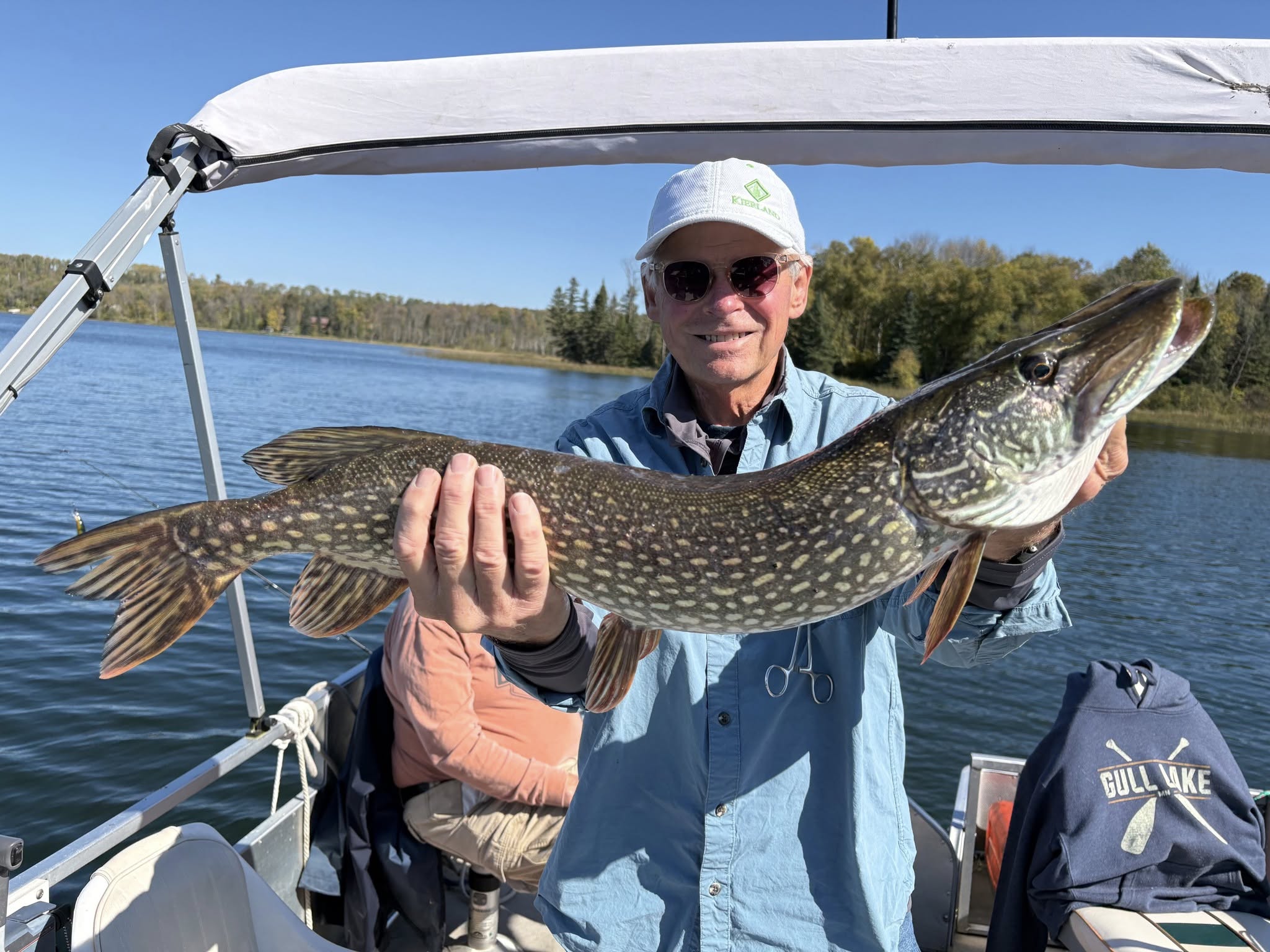 Fisherman Dan with a large Northern Pike on pontoon