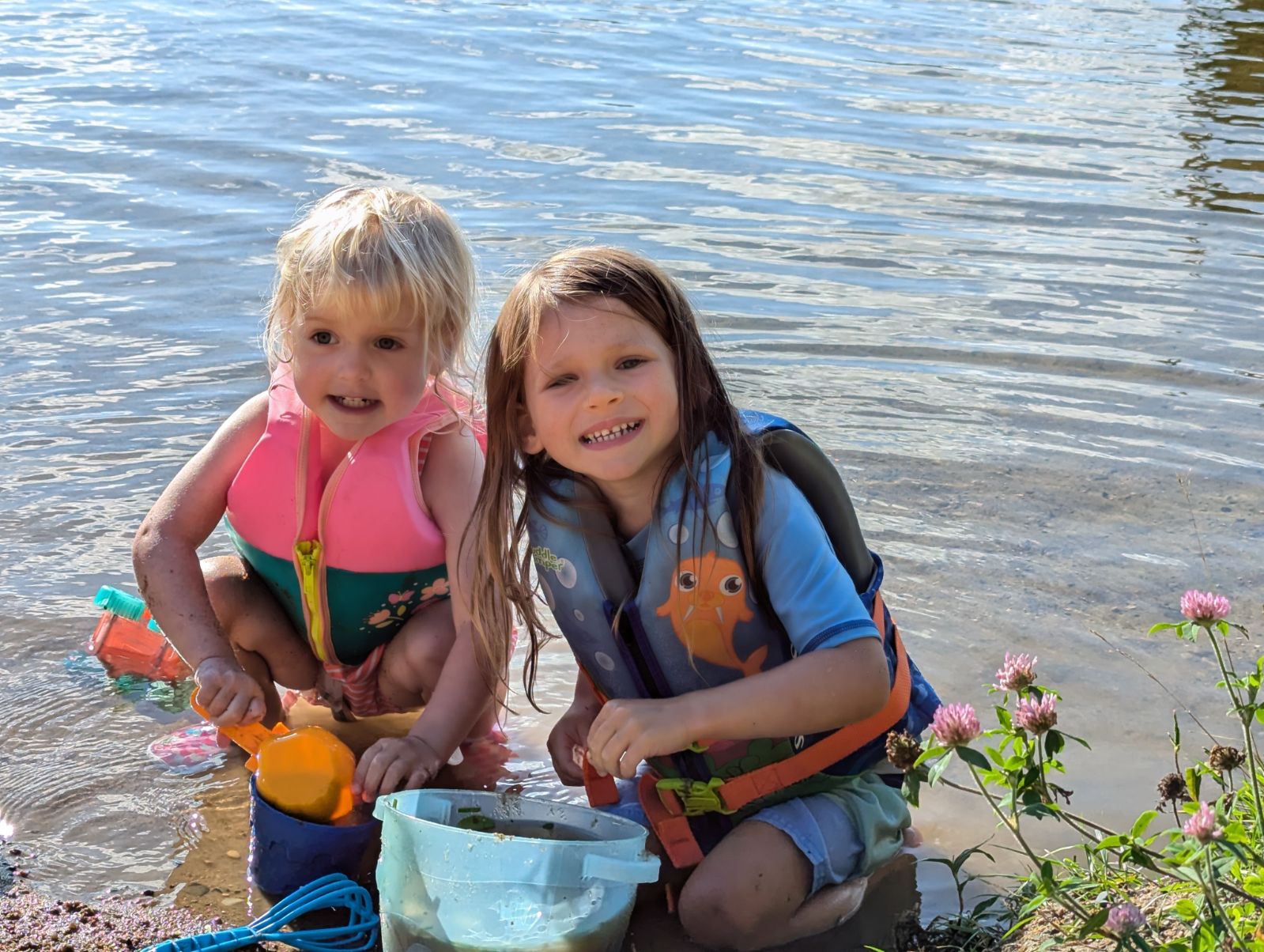 Two friends playing on the beach