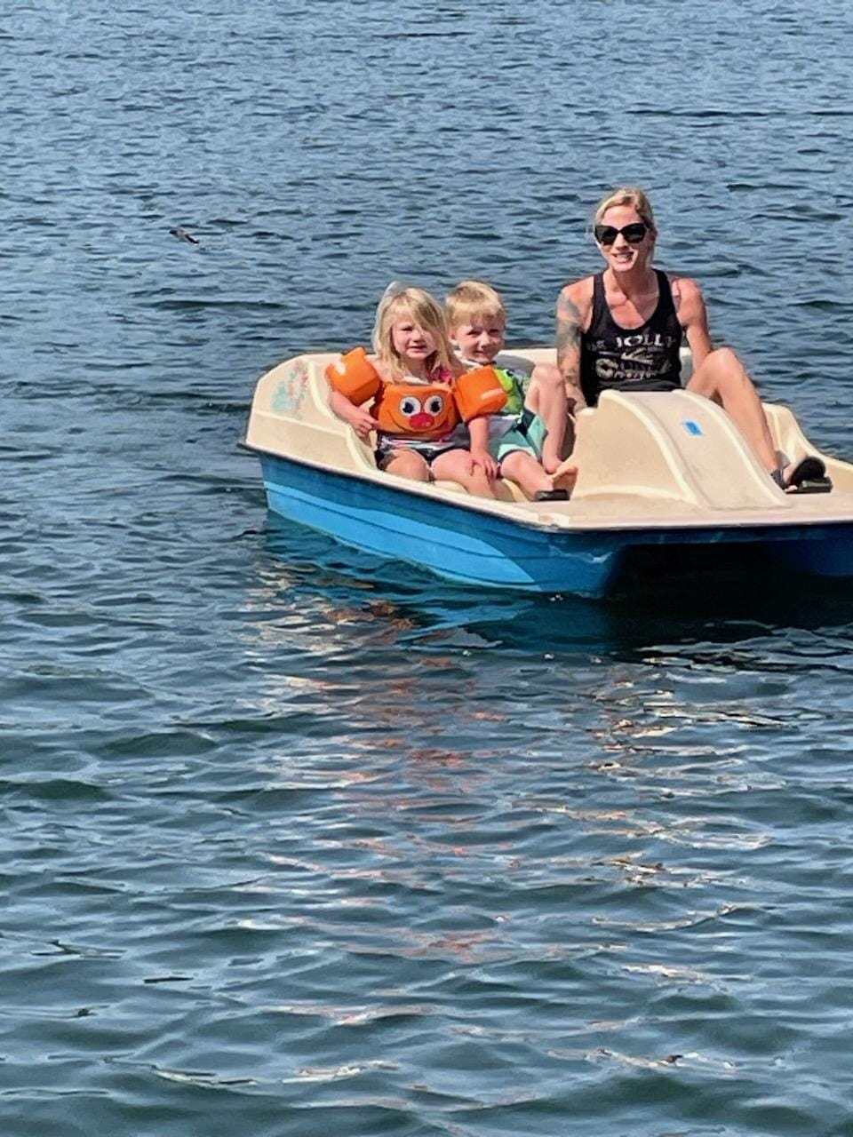 Mom and two kids on the paddleboat at Jolly Fisherman Resort