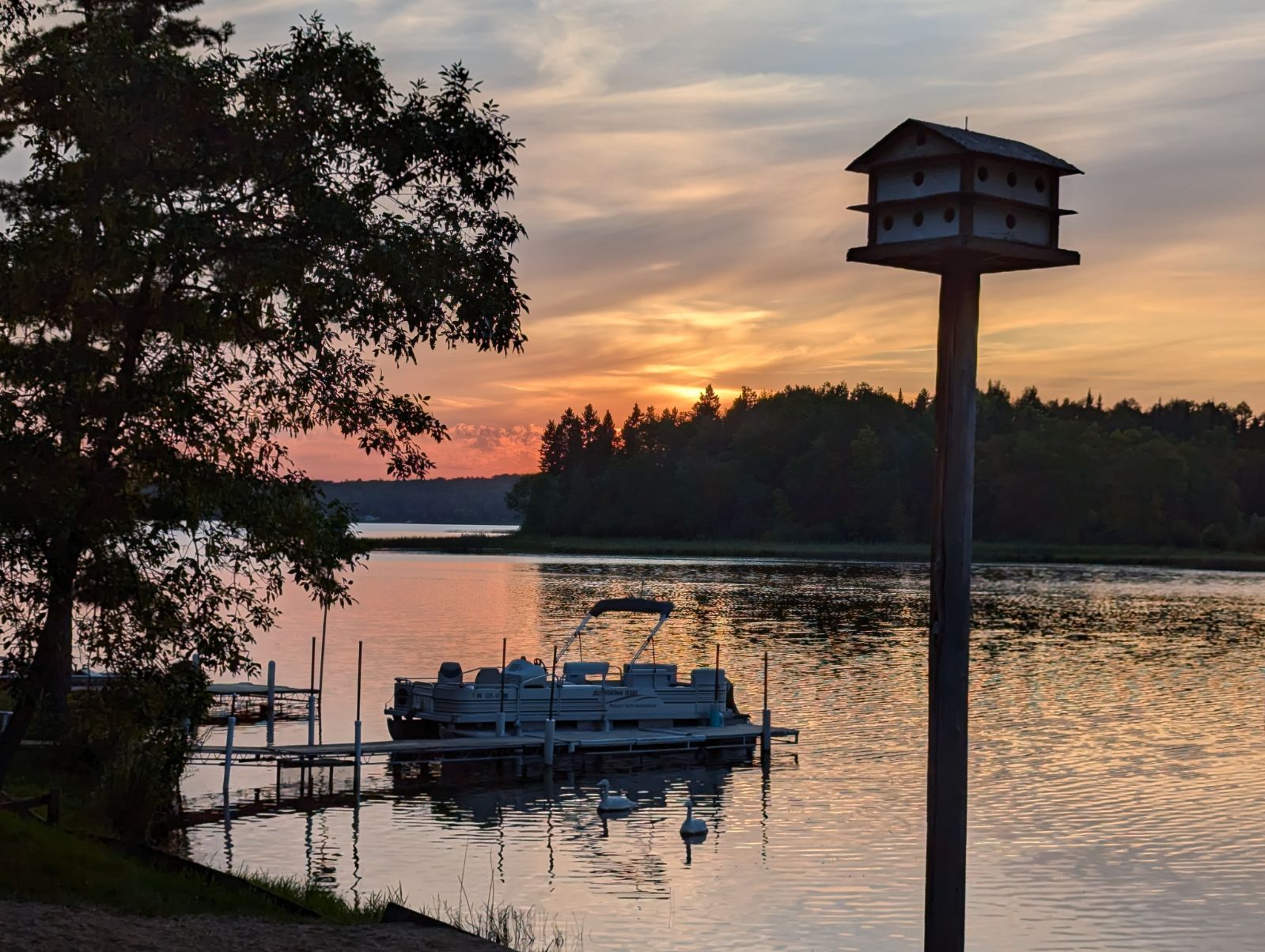 Sunset on beach with pontoon
