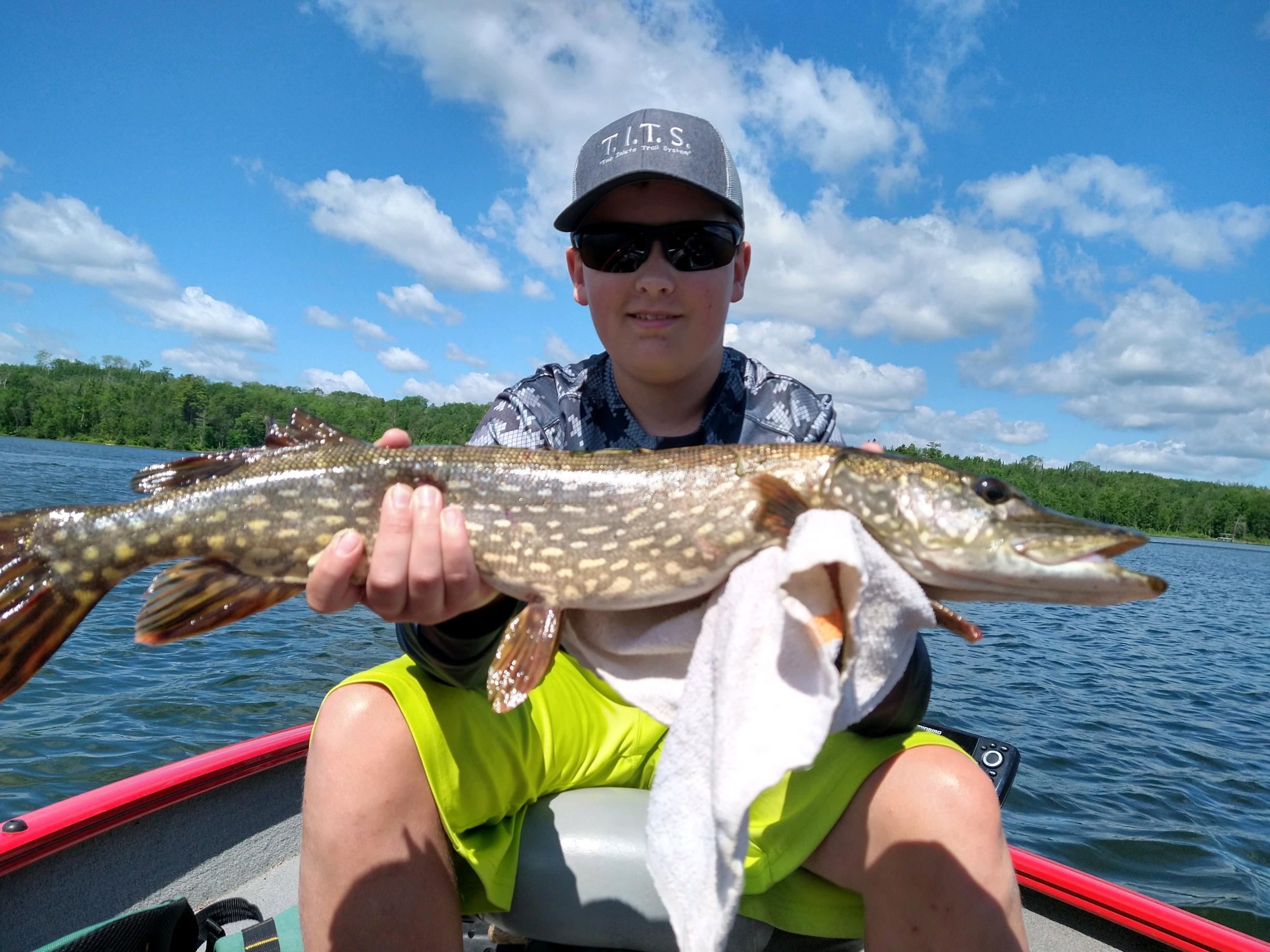 Boy with northern pike