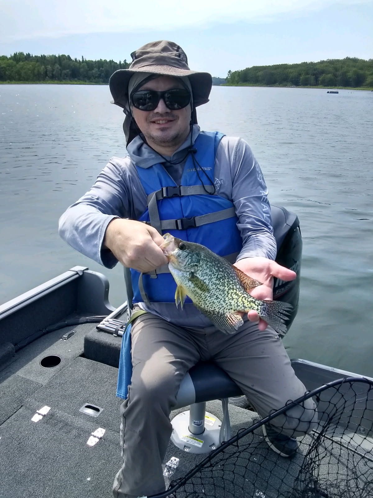 Fisherman holding crappie