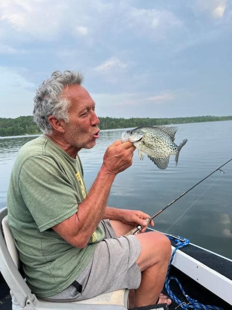 Man making smooch face at a crappie