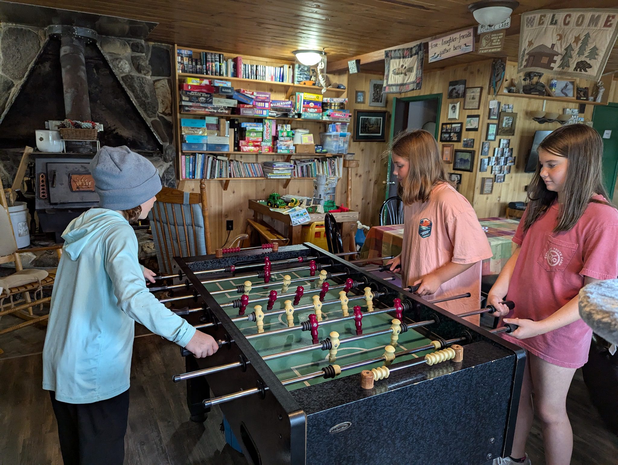 Kids playing foosball