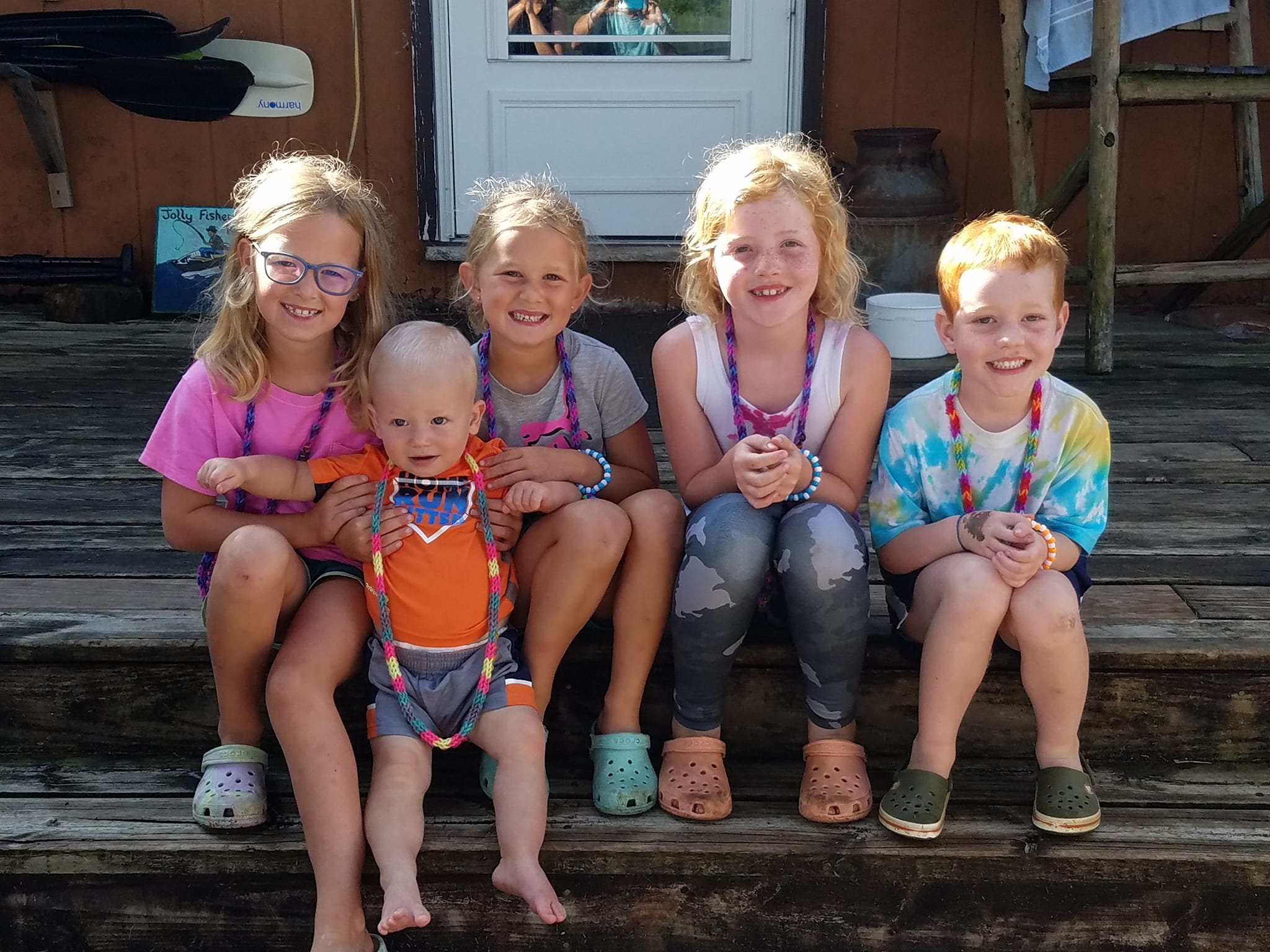 Group of kids in front of the Jolly Fisherman lodge