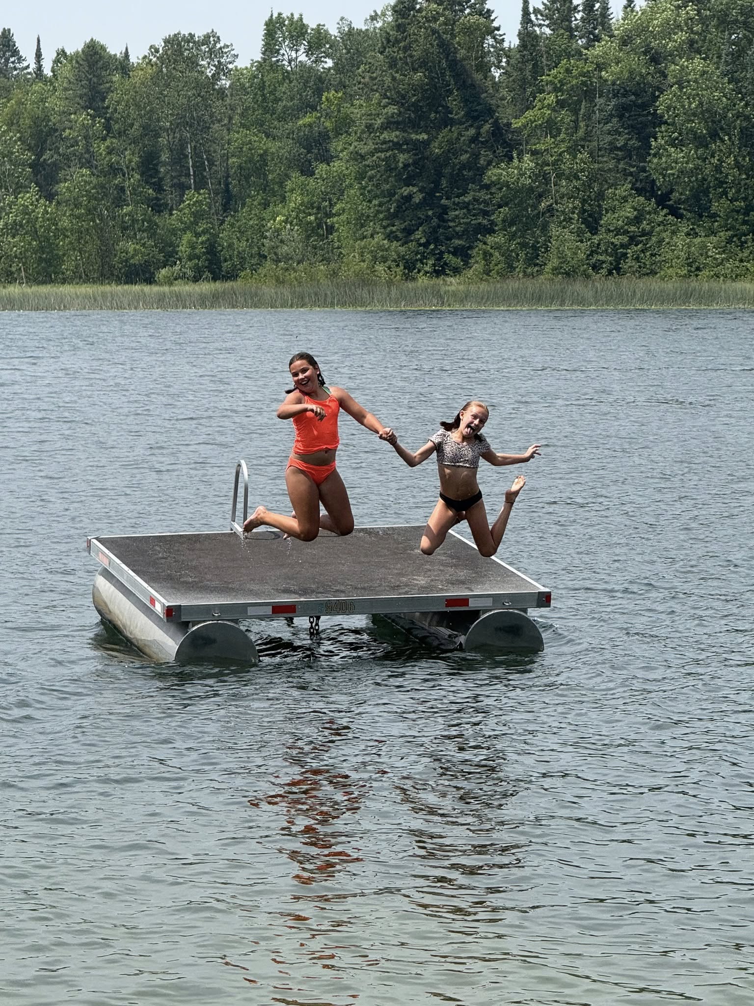 Kids jumping off the floating dock